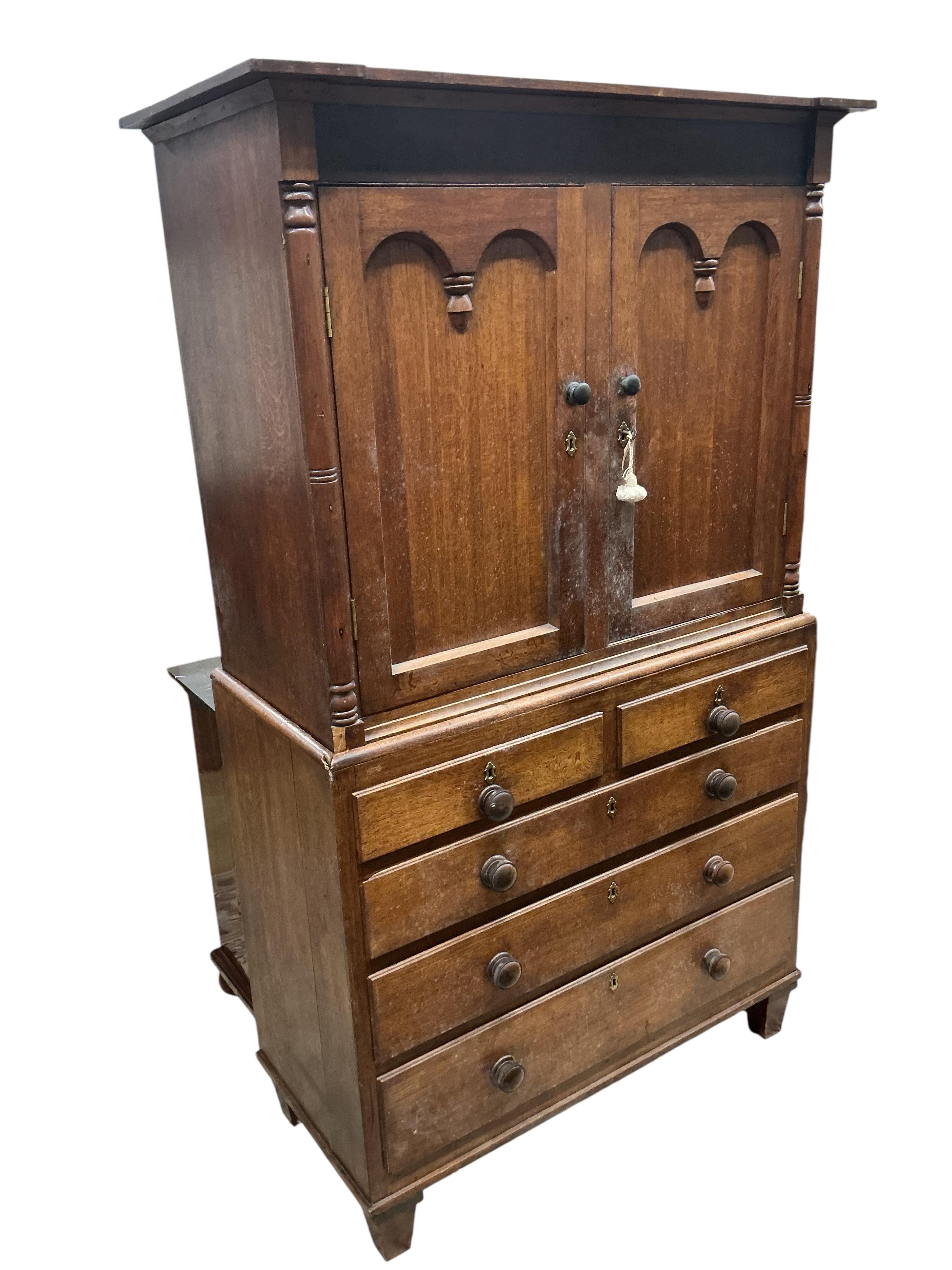 A 19th century oak press cupboard, width 117cm, depth 54cm, height 198cm